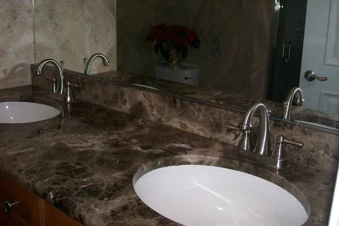 Dark brown marble vanity top with two undermount sinks