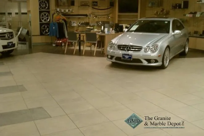 Car dealership showroom finished in polished stone flooring