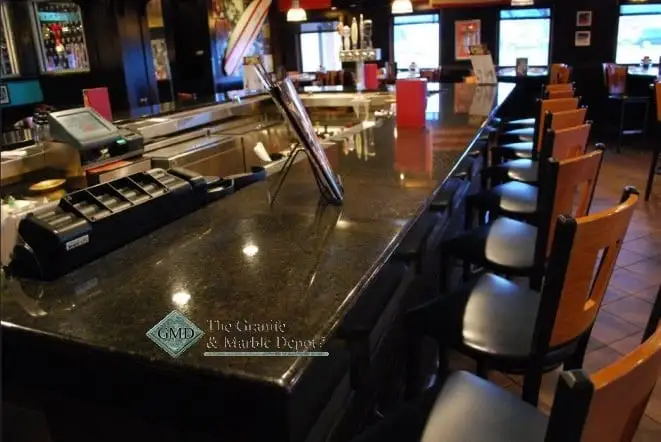 Restaurant service counter finished in dark granite