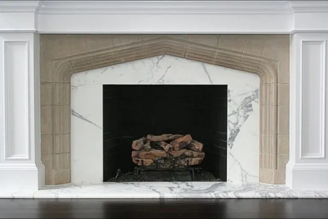 White marble fireplace surround and hearth with a classic painted mantel