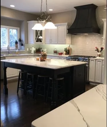 White quartz perimeter counters with a contrasting dark island